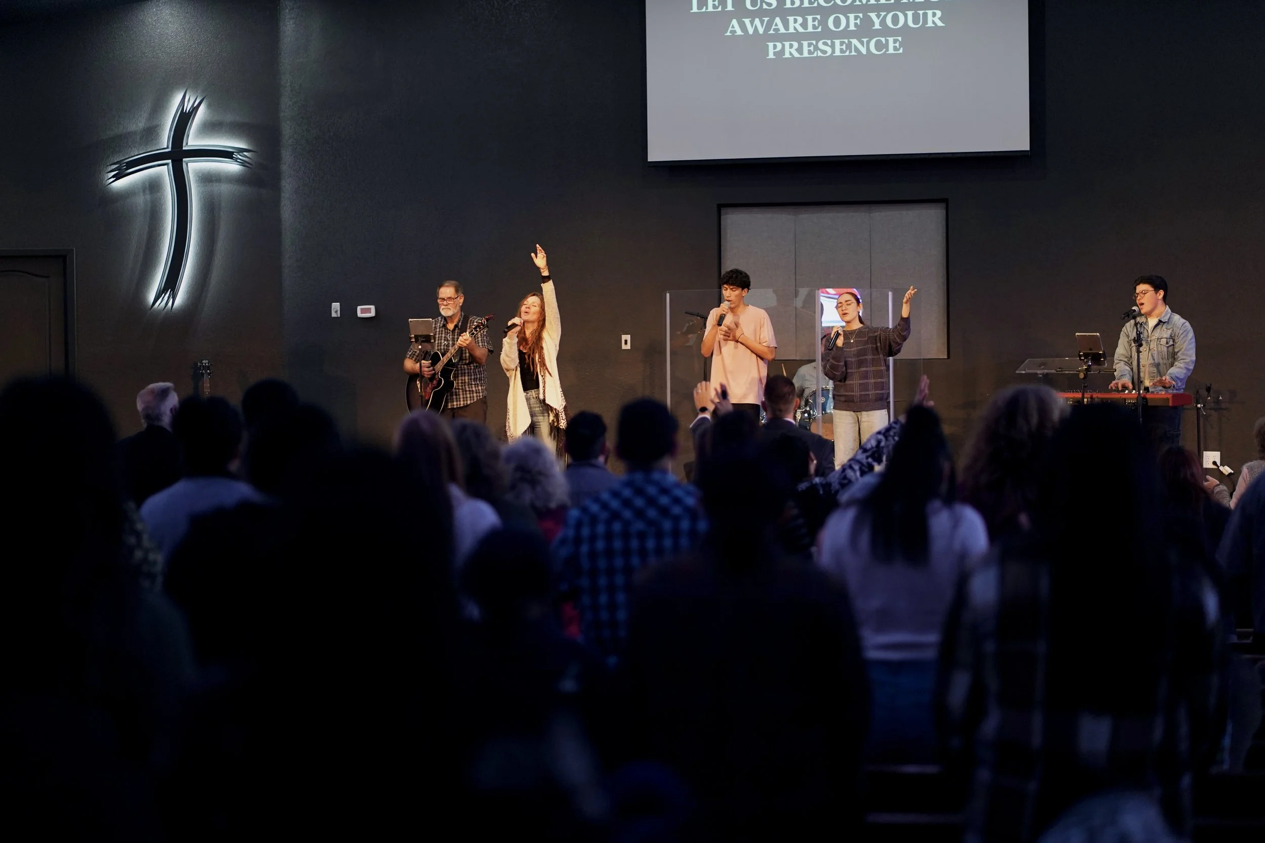 Tulare First congregation worshiping together during a service